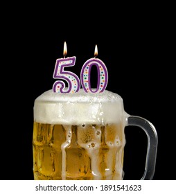 Lit Number Candles In Beer Mug For 50th Birthday Celebration Isolated On Black