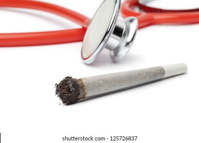 Lit Reefer With Stethoscope Out Of Focus On White Background