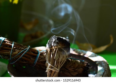 A Lit Sage Smudge Stick