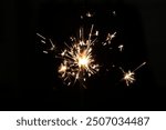 Lit sparklers isolated on a black background