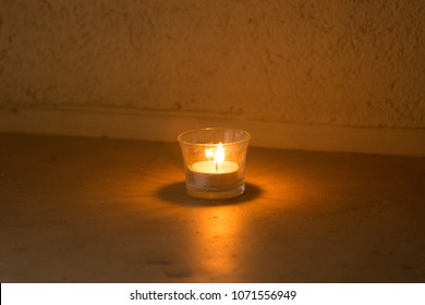 A Lit Votive Candle