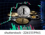 Litecoin cryptocurrency investing concept with graph. Bitcoin and Litecoin cryptocurrency coins symbol. Trading on the cryptocurrency exchange. Trends in lite coin and bitcoin exchange rates. Rise and