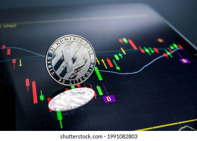 Litecoin currency with blockchain concept on laptop and charts and graphs.