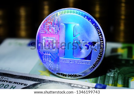 Litecoin LTC is surrounded by a money background.