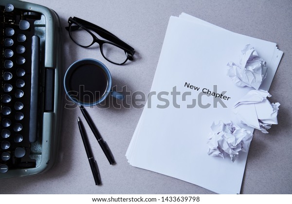 Literature, author and\
writer, writing and journalism concept: typewriter, cup of coffee\
and glasses and a\
paper