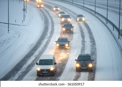 LITHUANIA, VILNIUS - JAN 11, 2016: Traffic in Vilnius during winter snowstorm. Roads slippery with snow or ice can cause vehicles to go out of control easily.