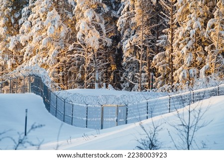 Lithuanian border. State border with Russia. Barbed fence between Russia and Lithuania. Border stretch in winter.