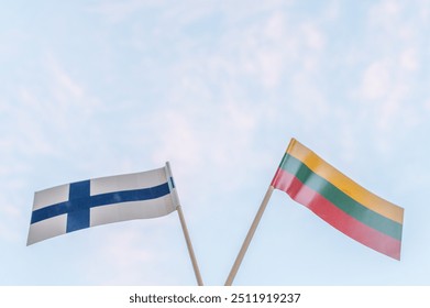 Lithuanian buying Helsinki Seagulls. Finalnd stadium. Helsinki basketball team. Flag of Lithuania and flag of Finland on a sky background - Powered by Shutterstock