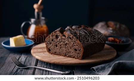 Lithuanian dark rye bread, dense and slightly sour, made using traditional baking techniques. It’s a staple in Lithuanian cuisine, often served with butter, cheese, or as a base for other dishes.