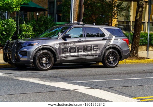 Lititz, PA, USA - August 21, 2020: A Lititz\
Police Department marked police cruiser parked in the downtown area\
of the borough.