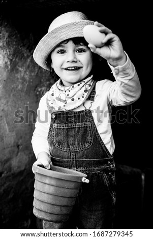 Similar – stylish little gentleman in hat looking up