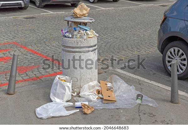 Litter Bin\
Overloaded at Street City Garbage\
Problem