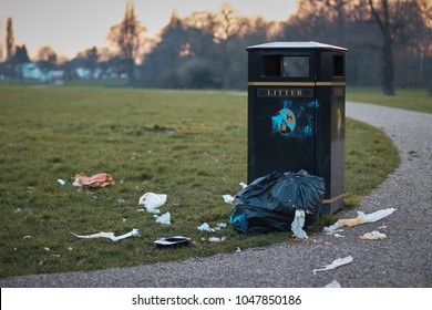 The litter bin in public park and litter around . - Shutterstock ID 1047850186