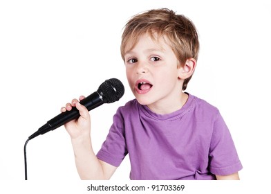 little adorable boy with a microphone isolated