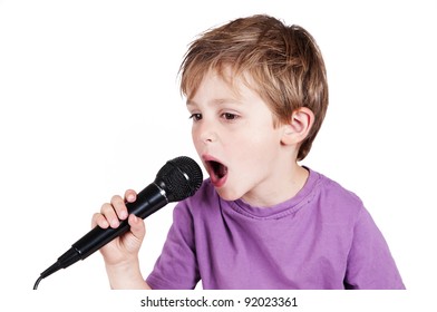 little adorable boy singing in a studio