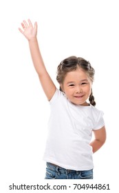 Little Adorable Child Waving And Looking At Camera, Isolated On White  