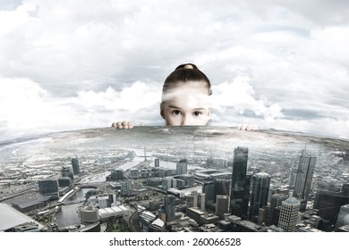 Little Adorable Looking At City Model From Under Table