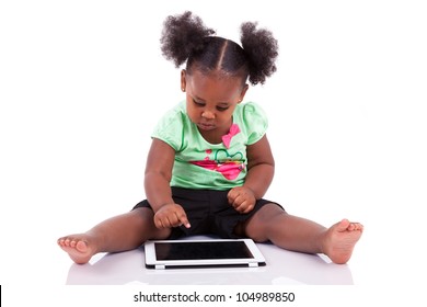 Little African American Girl Using A Tablet  Pc, Isolated On White Background