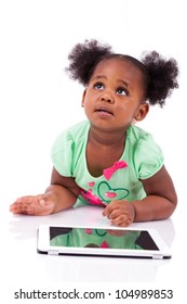 Little African American Girl Using A Tablet  Pc, Isolated On White Background