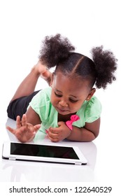 Little African American Girl Using A Tablet  Pc, Isolated On White Background