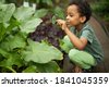 black child gardening