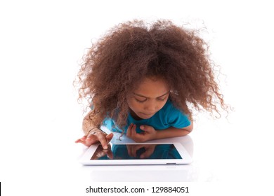 Little african asian girl using a tablet  pc, isolated on white background