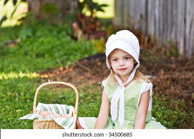 Little Amish Girl Gathering Eggs