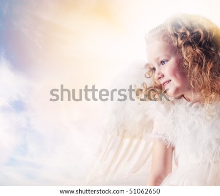 Little angel girl against sunny sky