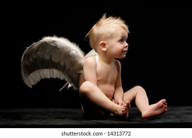 Baby Angel Wings Sitting Sideways Laughing Stock Photo (Edit Now) 19484749