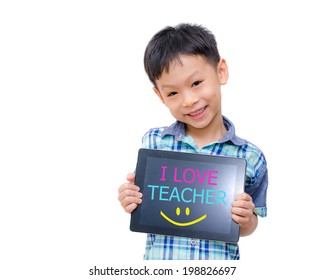 Little asian boy holding tablet computer with word "I love teacher" on screen