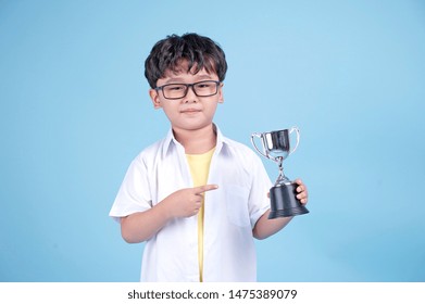 Little Asian Boy Learning Chemical In Science With White Blouse Coat, Isolated On Blue Background