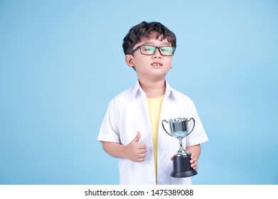 Little Asian Boy Learning Chemical In Science With White Blouse Coat, Isolated On Blue Background