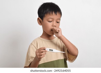 Little Asian boy is sick with flu and coughing holding a thermometer isolated on a white background. healthcare concept - Powered by Shutterstock