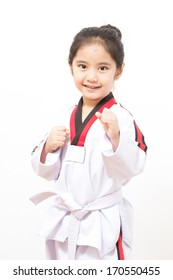 Little asian child in fighting action on isolated background