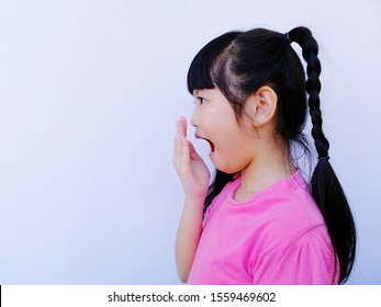 Little Asian Child Girl Covering Her Mouth For Smell Her Bad Breath, Oral Health Care Problem Concept