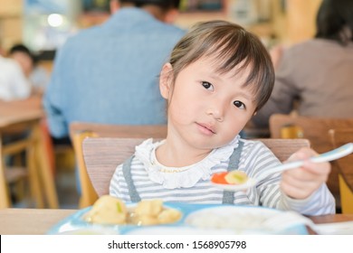 Little Asian Child Girl With Unhappy Face While Having Lunch On Table In Restaurant,picky Eater Don't Want To Eat Or Not Hungry