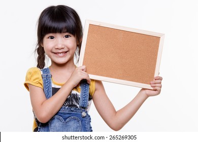 Little Asian Child Holding Empty Board Over White Background