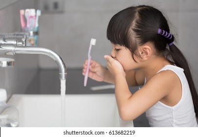 Little asian cute girl brush teeth