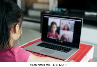 Little Asian Girl Attending To Online E-learning Platform Class From Home While School Has Been Closed During Coronavirus Outbreak.