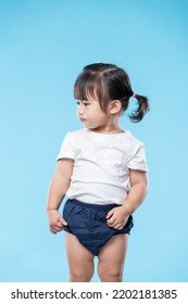Little asian girl over blue background - Shutterstock ID 2202181385