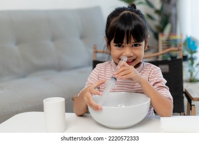 Little Asian Girl Saline Nasal Wash Nose At Home.