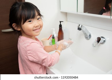 Little Asian Girl Washing Hands