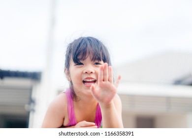 Little Asian Girl Waving Hand For Good Bye In The Moon Roof Car.Concept: Bye Summer And Go To School.Outdoor Portrait: Beautiful Kid Smiling And Waving Say Good Bye.