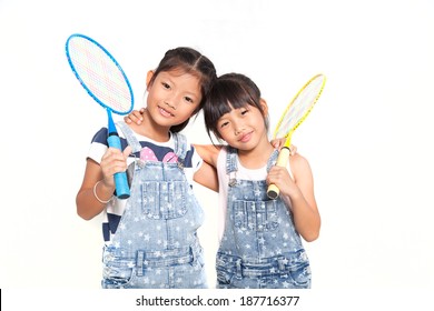 Little asian girls with badminton isolate on white background