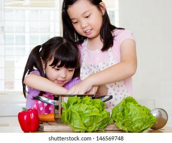 Little Asian Girls Cooking