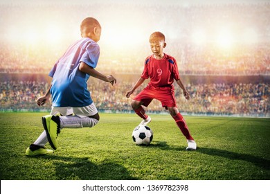 Little Asian Soccer Kids In Action In The Stadium