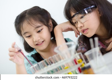 Little Asian Student Girl Making Science Experiment In The Laboratory Class