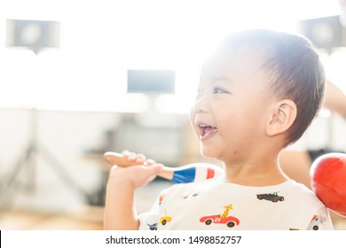 Little Asian Toddler Boy Play Colorful Maracas And Sing A Song In Class Room.Pre Kindergarten Boy Play Music.Child Development EQ And EF.Child With Music Instruments.Musical Education.