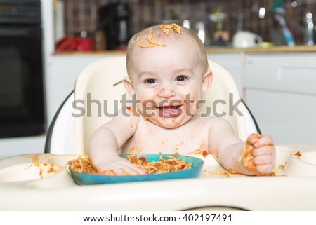 A Little b eating her dinner and making a mess