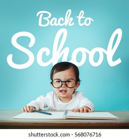 Little Baby Asian Girl On Blackboard With Back To School, Education And Preschool Concept